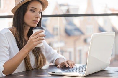 Lady-drinking-Coffee-on-Computer_0.jpg